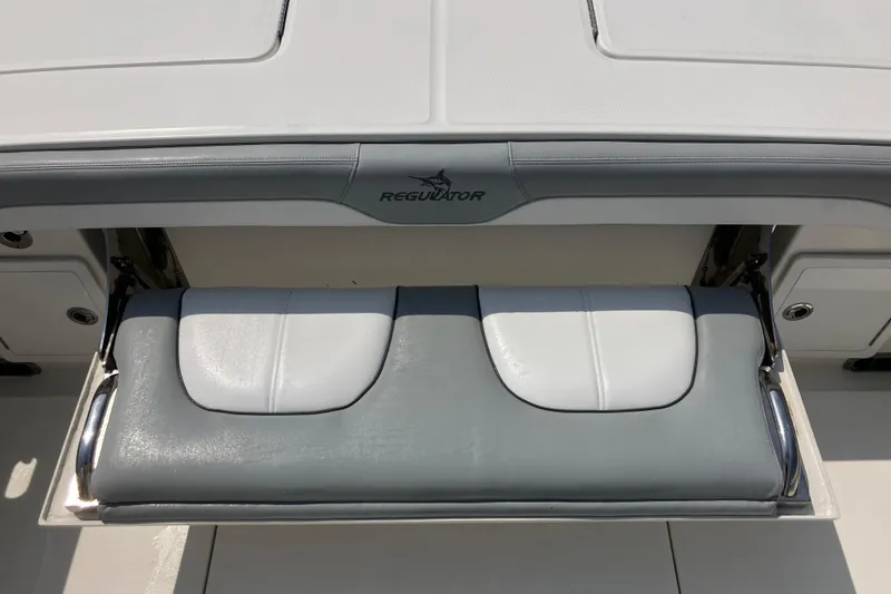 Slide: The Image of 2020 Regulator 31 boat seat with gray and white cushioned design. - 6