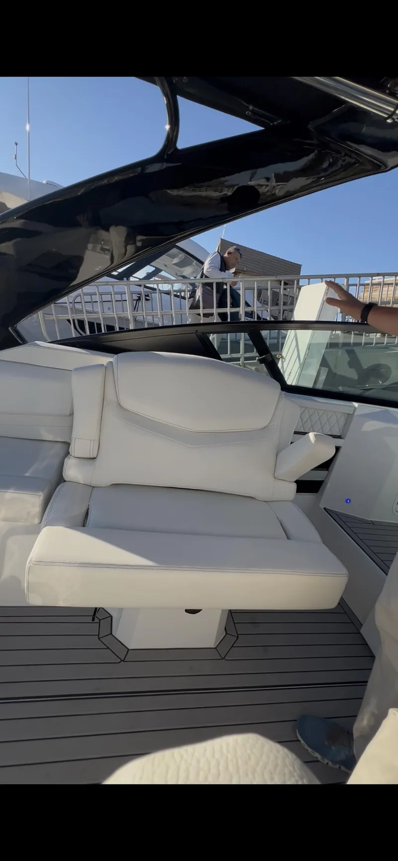 Slide: The Image of 2020 Cruisers Yachts 338OB interior with white seating and wooden table. - 13