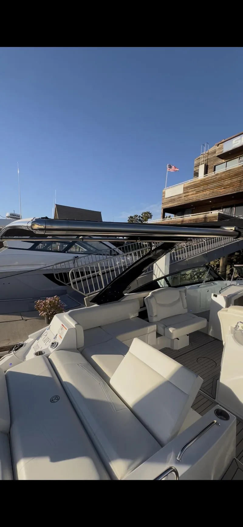 Slide: The Image of 2020 Cruisers Yachts 338OB dashboard with steering wheel and navigation display. - 18