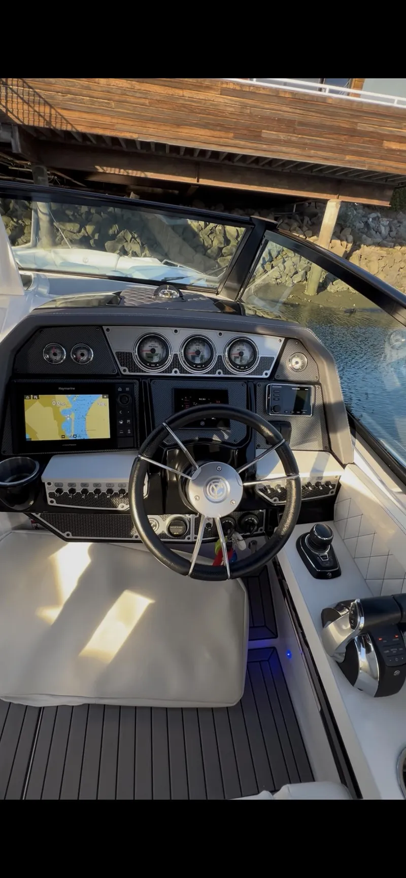 Slide: The Image of 2020 Cruisers Yachts 338OB helm with modern controls and navigation displays. - 19