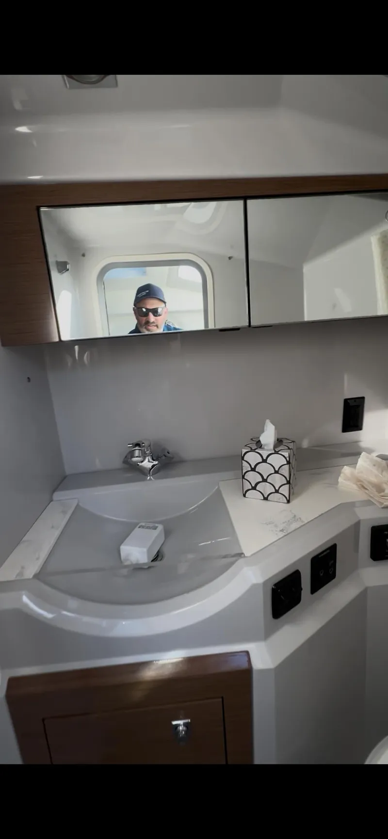 Slide: The Image of 2020 Cruisers Yachts 338OB engine compartment with multiple batteries and wiring. - 27