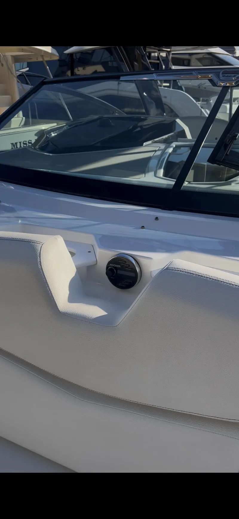 Slide: The Image of 2020 Cruisers Yachts 338OB interior with waterfront view, featuring sleek seating and speaker system. - 9