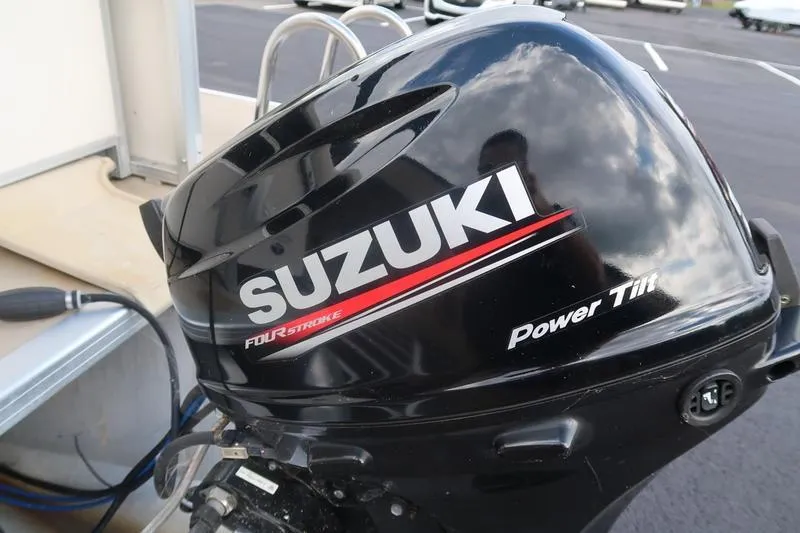 Slide: The Image of Suzuki four-stroke outboard motor on 2010 Smoker Craft Sunchaser 8522 boat. - 16