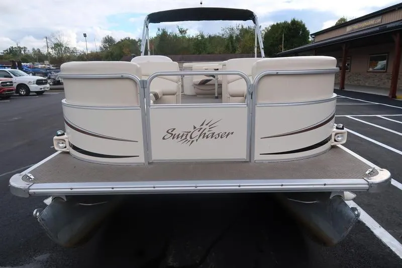 Slide: The Image of 2010 Smoker Craft Sunchaser 8522 pontoon boat, rear view in parking lot. - 4