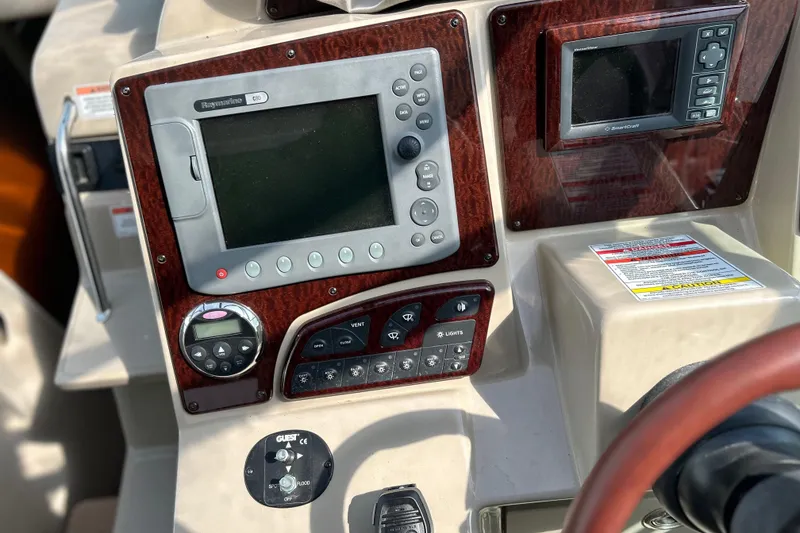 Slide: The Image of Control panel of 2008 Sea Ray 330 Sundancer with navigation and control systems. - 14