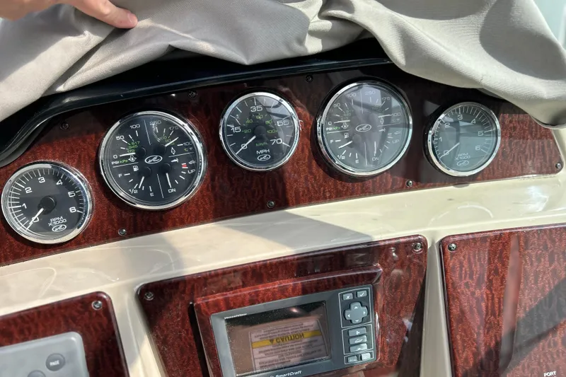 Slide: The Image of Dashboard of a 2008 Sea Ray 330 Sundancer with gauges and controls. - 16