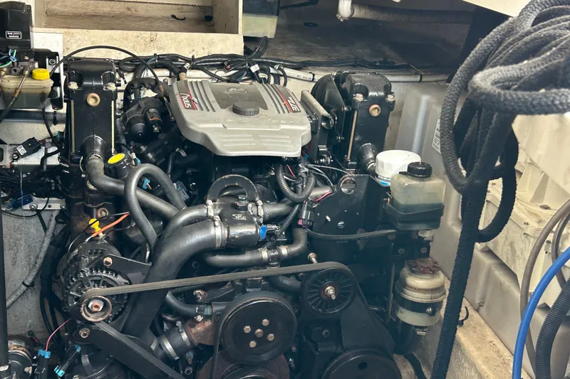 Slide: The Image of Engine compartment of a 2008 Sea Ray 330 Sundancer boat, showcasing detailed mechanical components. - 19