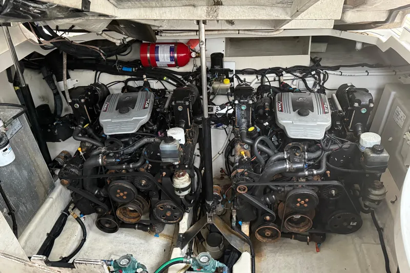 Slide: The Image of Engine room of a 2008 Sea Ray 330 Sundancer with twin engines and fire extinguisher. - 28