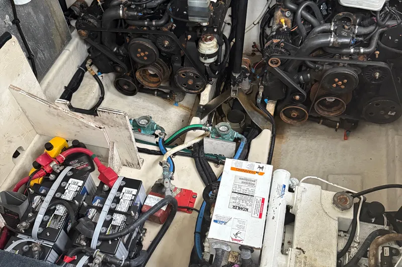Slide: The Image of Engine compartment of a 2008 Sea Ray 330 Sundancer with visible batteries and components. - 31