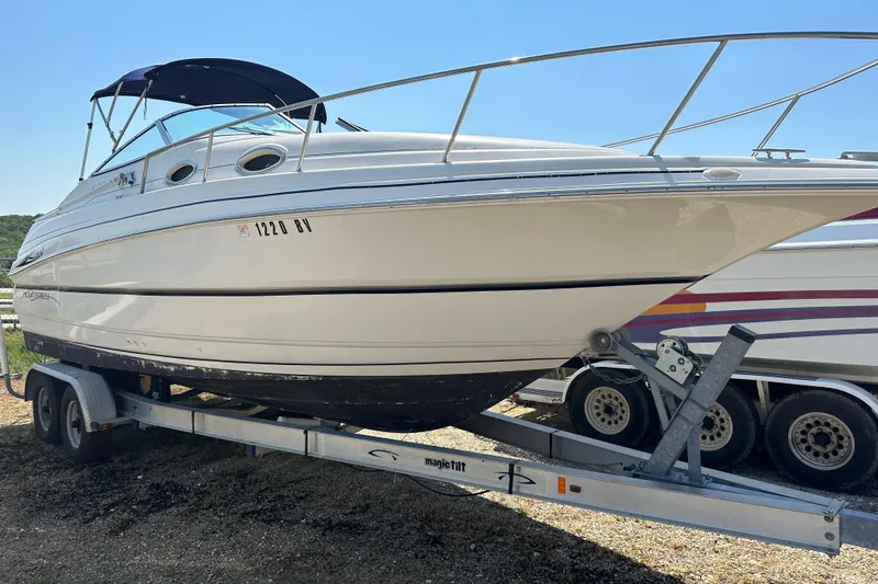 The Image of 1999 Monterey 262 Cruiser boat on trailer, side view, sunny day. - 1