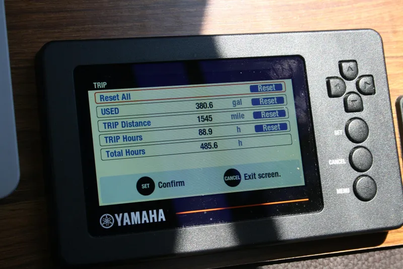Slide: The Image of Yamaha trip display showing fuel usage and distance on 2018 Ranger Tugs R-23. - 19
