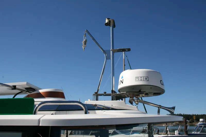 Slide: The Image of 2018 Ranger Tugs R-23 boat with radar and equipment against clear blue sky. - 31