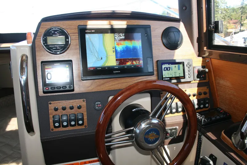 Slide: The Image of 2018 Ranger Tugs R-23 helm with navigation and control systems. - 6