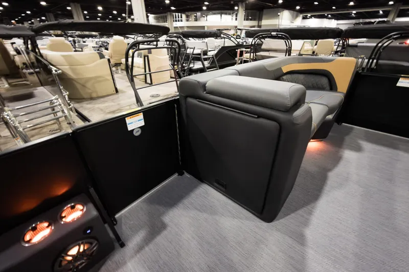Slide: The Image of 2026 Godfrey Sweetwater 22' Tritoon interior with luxurious seating and ambient lighting. - 16