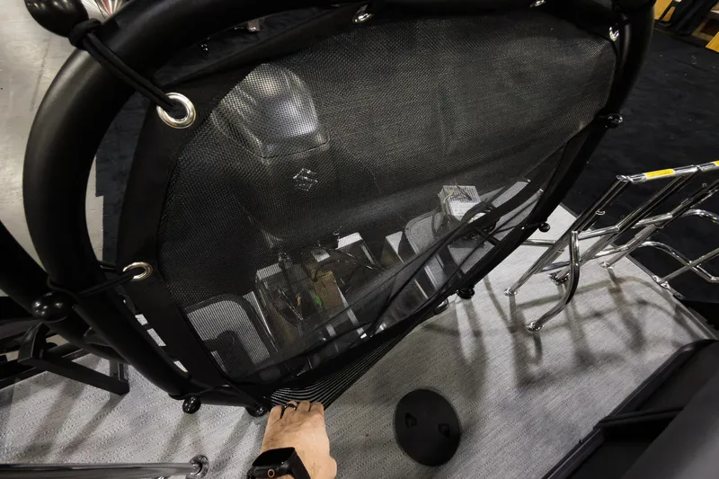 Slide: The Image of 2026 Godfrey Sweetwater 22' Tritoon interior with mesh cover and ladder detail. - 25