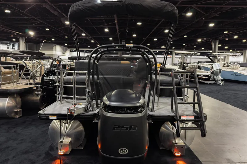 Slide: The Image of 2026 Godfrey Sweetwater 22' Tritoon with 250 HP engine at a boat show. - 4