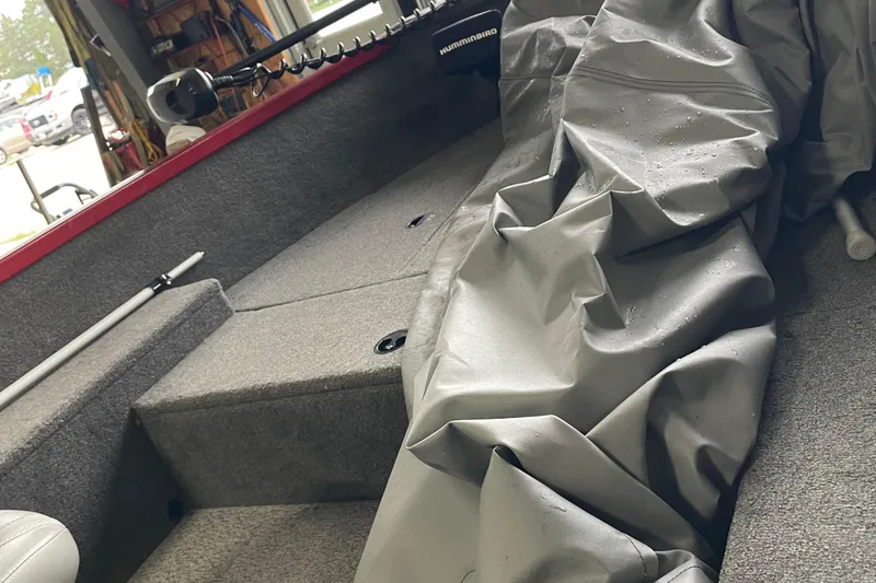 Slide: The Image of 2018 Alumacraft Classic 165 CS boat interior with gray cover and Humminbird equipment. - 12