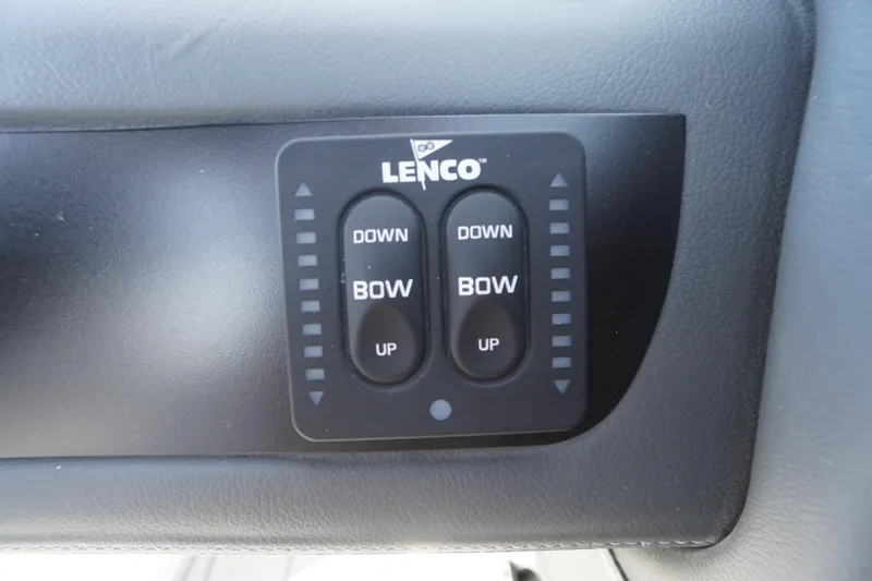 Slide: The Image of Lenco trim tab control panel on 2026 Chaparral 250 OSX boat dashboard. - 17