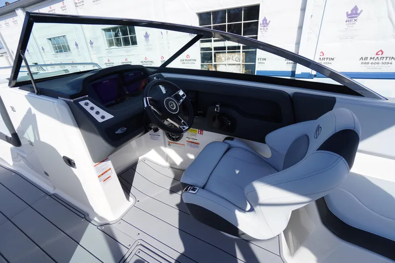 Slide: The Image of 2026 Chaparral 250 OSX boat cockpit with modern steering and seating. - 20