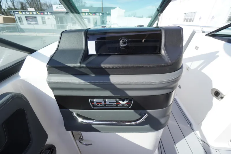 Slide: The Image of 2026 Chaparral 250 OSX boat dashboard with sleek design and modern controls. - 23