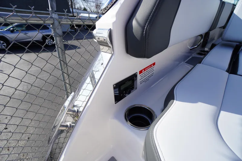 Slide: The Image of 2026 Chaparral 250 OSX boat interior with seating, cup holder, and control panel. - 47
