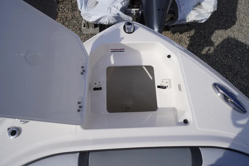 Slide: The Image of Open storage compartment on 2026 Chaparral 250 OSX boat, showcasing interior details. - 5
