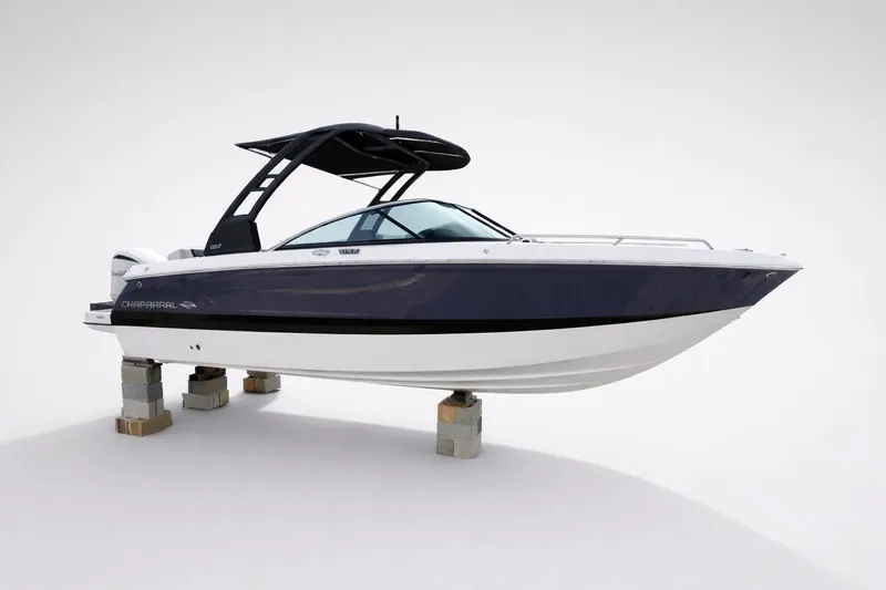 Slide: The Image of 2026 Chaparral 250 OSX boat on display, featuring sleek design and modern architecture. - 61