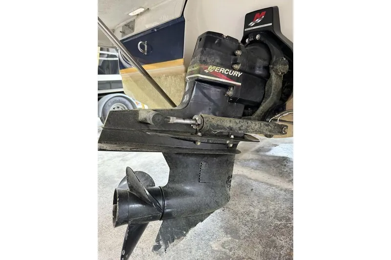 Slide: The Image of 2002 Regal 2100 LSR boat with Mercury outboard motor, close-up view. - 13