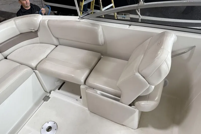 Slide: The Image of 2002 Regal 2100 LSR boat interior with white leather seating and adjustable backrest. - 15