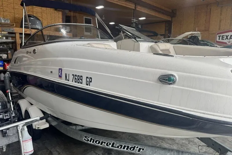 Slide: The Image of 2002 Regal 2100 LSR boat on ShoreLand'r trailer in garage setting. - 3