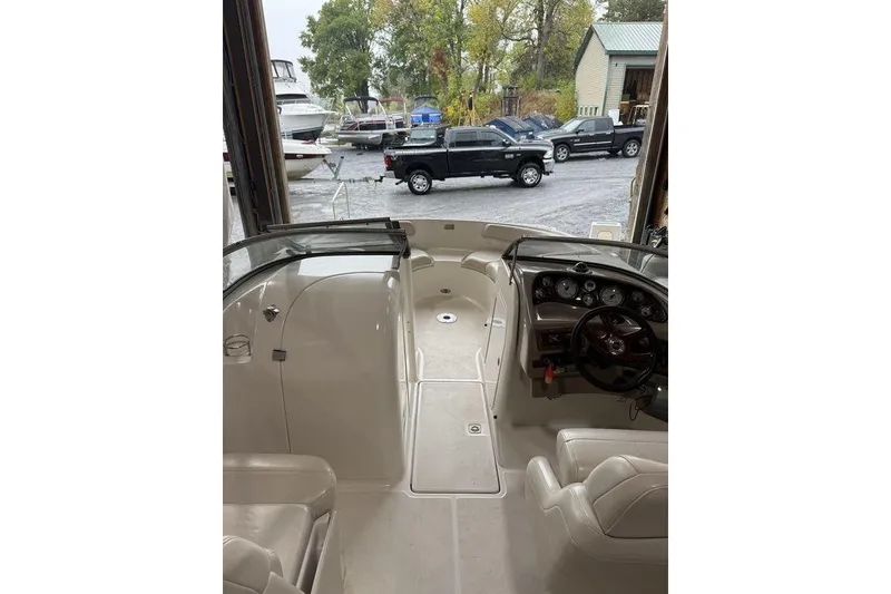 Slide: The Image of Interior view of a 2002 Regal 2100 LSR boat with dashboard and seating. - 6