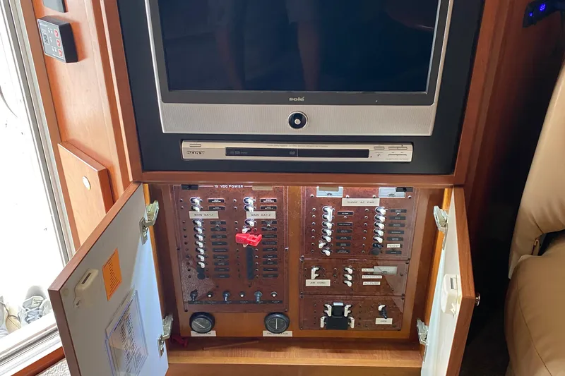 Slide: The Image of 2007 Silverton 36 Convertible yacht interior with TV and electrical panel. - 26