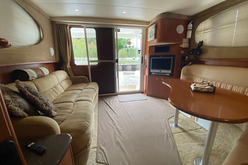 Slide: The Image of Luxurious interior of a 2007 Silverton 36 Convertible yacht with cozy seating and modern amenities. - 27