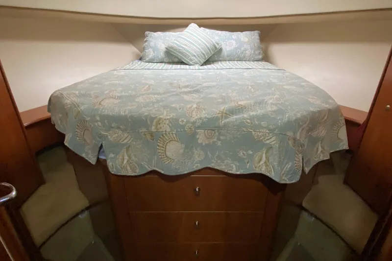 Slide: The Image of Cozy bedroom in 2007 Silverton 36 Convertible yacht with patterned bedding. - 36