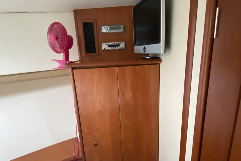 Slide: The Image of Interior of 2007 Silverton 36 Convertible with TV, stereo, and pink fan. - 37