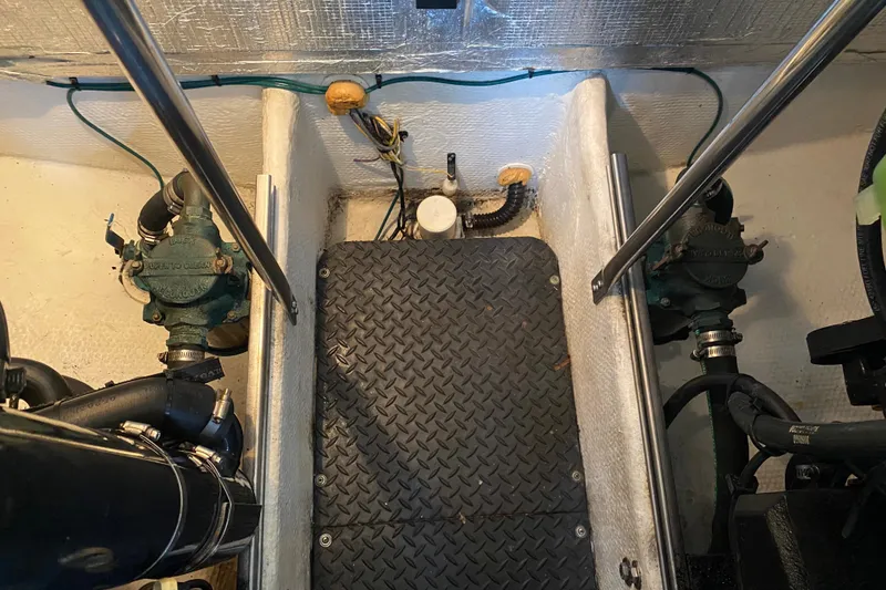 Slide: The Image of Engine room of a 2007 Silverton 36 Convertible boat, featuring mechanical components and wiring. - 44