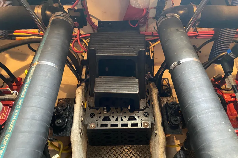Slide: The Image of Engine room of a 2007 Silverton 36 Convertible boat, showing exhaust and mechanical components. - 45