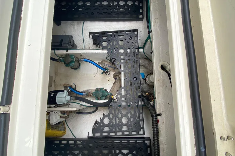 Slide: The Image of Engine compartment of a 2007 Silverton 36 Convertible boat, showing mechanical components and wiring. - 49