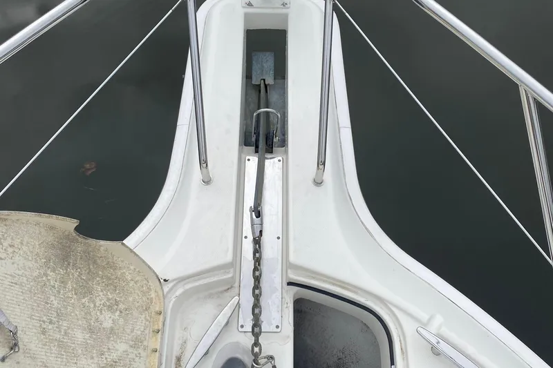 Slide: The Image of Bow view of 2007 Silverton 36 Convertible yacht with anchor chain and railing. - 7