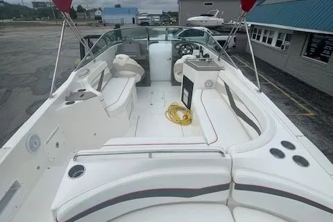 Slide: The Image of 2008 Rinker 282 Captiva Cuddy boat interior with seating and steering wheel. - 11