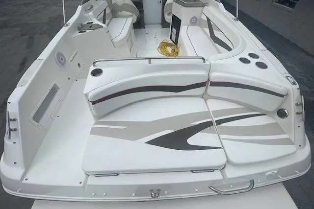 Slide: The Image of 2008 Rinker 282 Captiva Cuddy boat interior with white seating and modern design. - 12