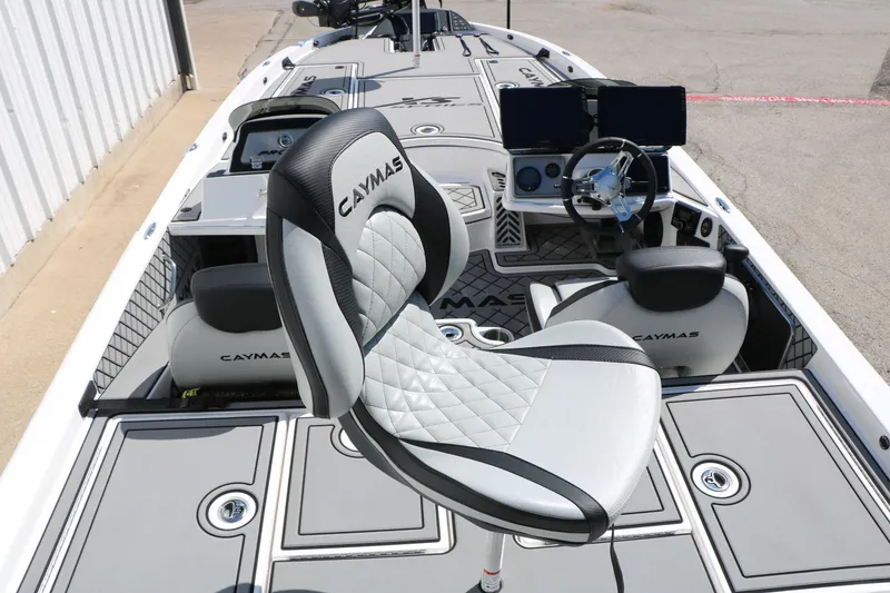 Slide: The Image of 2025 Caymas CX 21 PRO boat interior with modern seating and advanced dashboard controls. - 14