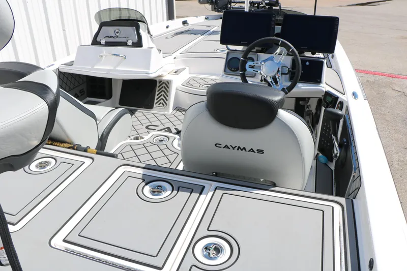 Slide: The Image of 2025 Caymas CX 21 PRO boat interior with advanced controls and seating. - 15