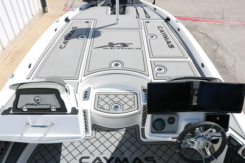 Slide: The Image of 2025 Caymas CX 21 PRO boat deck with advanced controls and sleek design. - 17