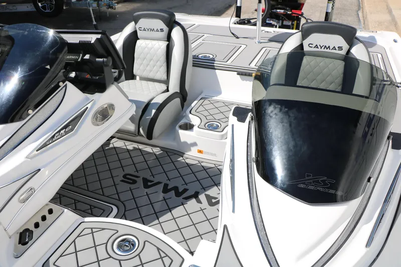 Slide: The Image of 2025 Caymas CX 21 PRO boat interior with sleek seats and modern dashboard design. - 24