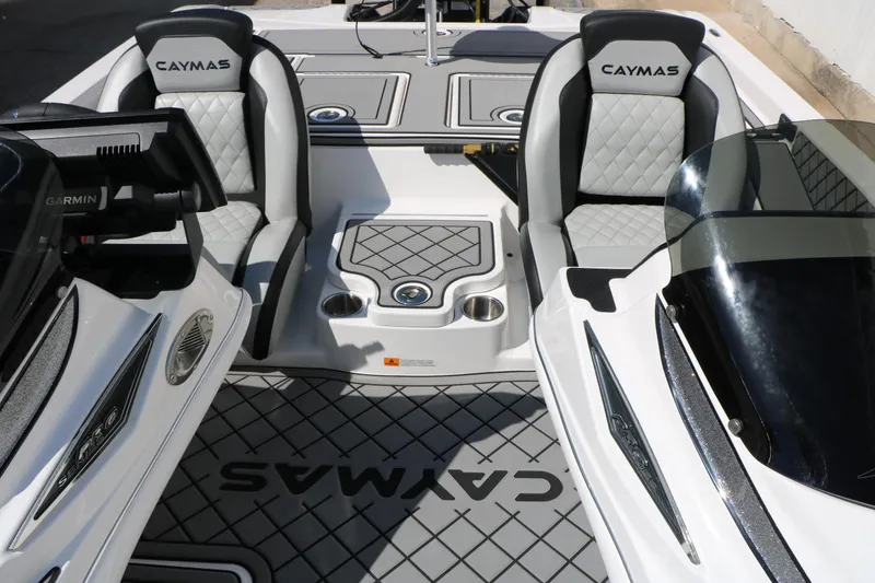 Slide: The Image of 2025 Caymas CX 21 PRO boat interior with dual seats and advanced dashboard. - 25