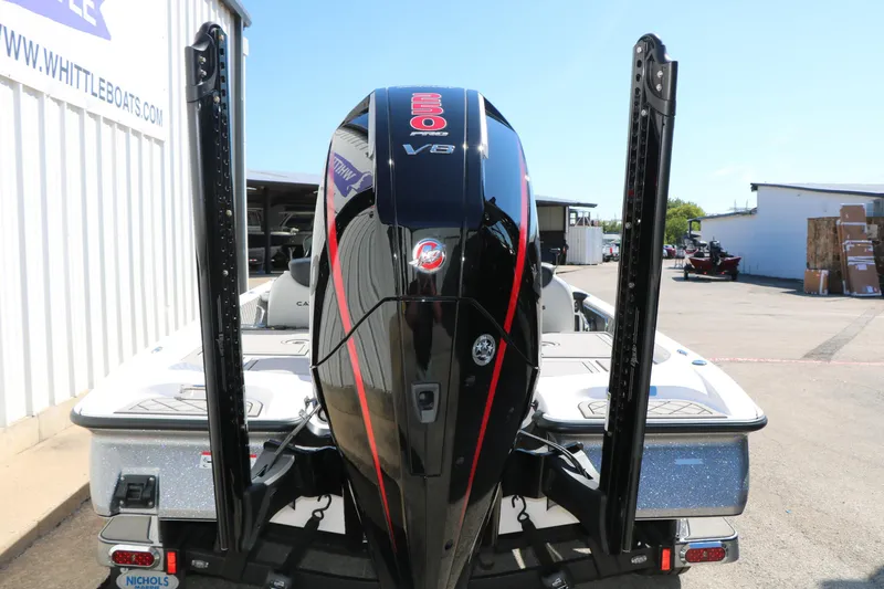 Slide: The Image of 2025 Caymas CX 21 PRO boat with powerful V8 engine, parked outdoors. - 3