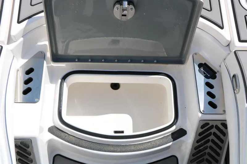 Slide: The Image of 2025 Caymas CX 21 PRO boat storage compartment with open lid and sleek design. - 31