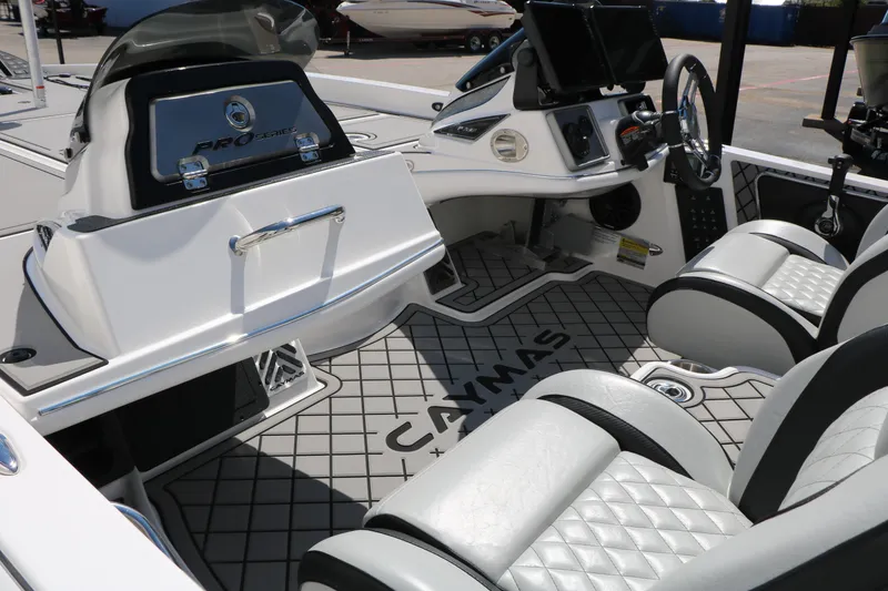 Slide: The Image of 2025 Caymas CX 21 PRO boat interior with modern dashboard and seating. - 34