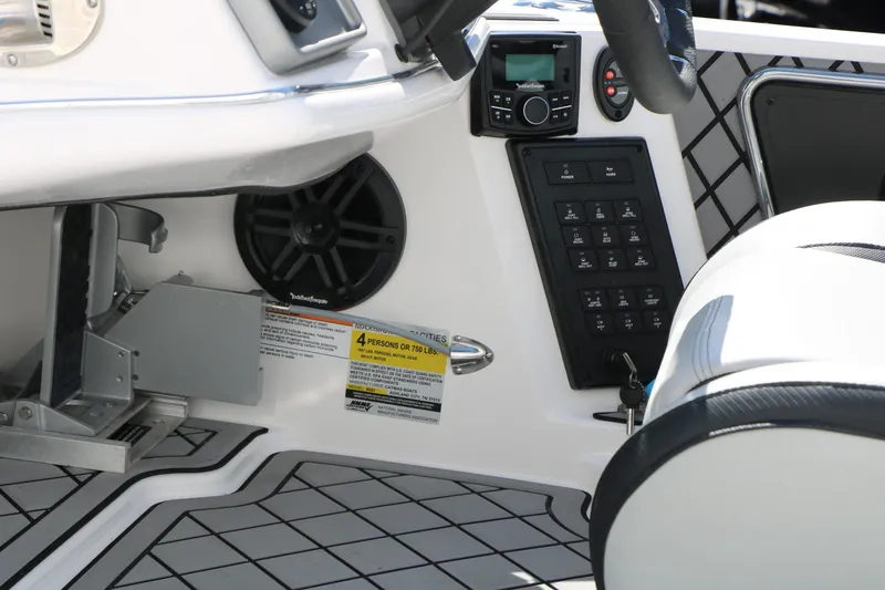 Slide: The Image of 2025 Caymas CX 21 PRO boat interior with control panel and speaker system. - 36